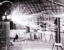 Publicity photo of Nikola Tesla sitting in his laboratory in Colorado Springs in December 1899